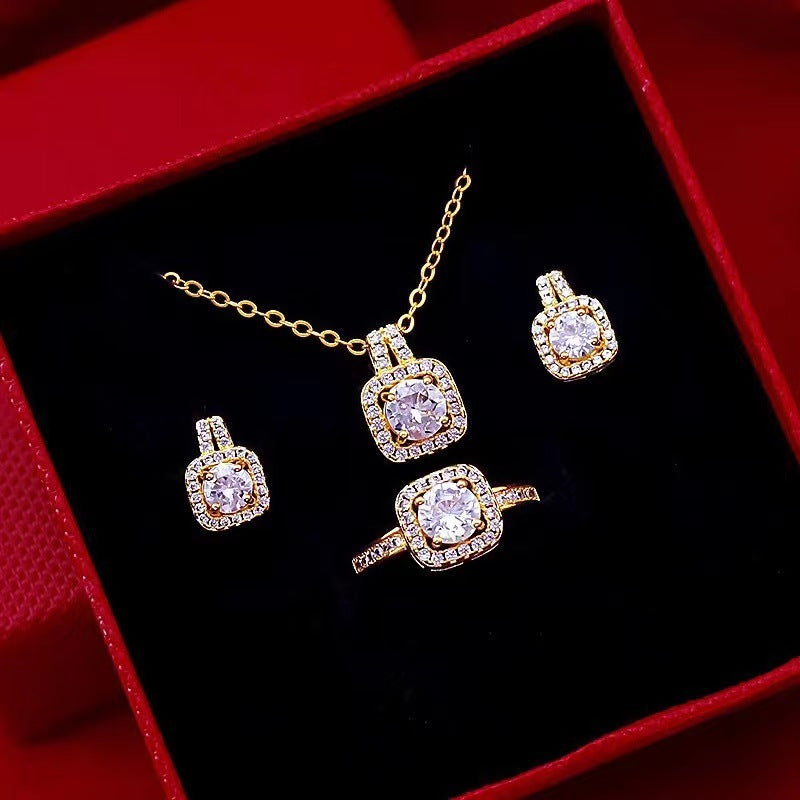 Opulent Zirconia Dazzle Jewelry Set - Gold Plated Statement Necklace, Studs & Ring Feminé Luxé