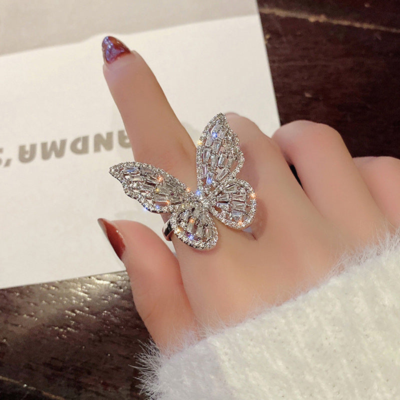 Feminé Luxé Exclusive Dazzling Micro-Pave Butterfly Statement Ring: Silver-Toned, Diamond-Treated Adjustable Finger Ring Feminé Luxé