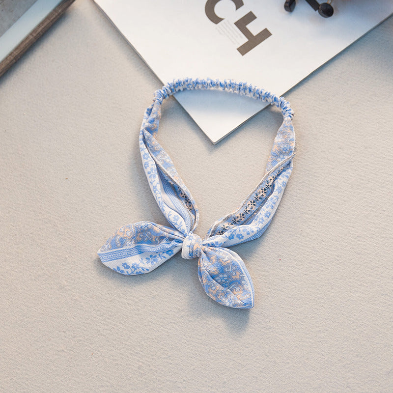 The Parisian Bow Headband: Chic Fabric Knot & Bunny Ear Tie - Designer Print Hair Accessory for Effortless French Style Feminé Luxé