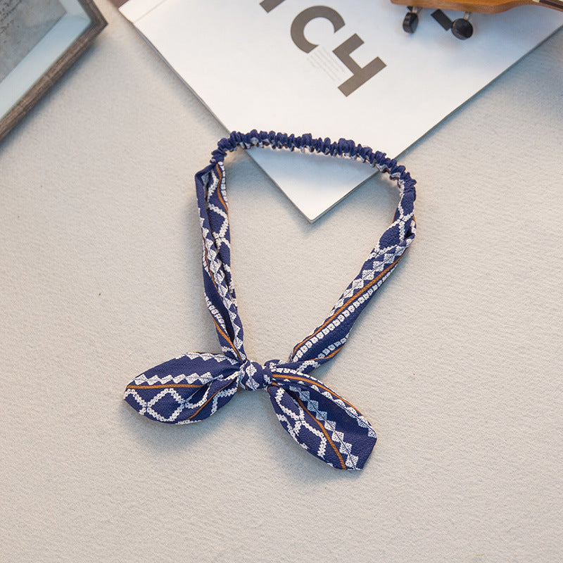 The Parisian Bow Headband: Chic Fabric Knot & Bunny Ear Tie - Designer Print Hair Accessory for Effortless French Style Feminé Luxé