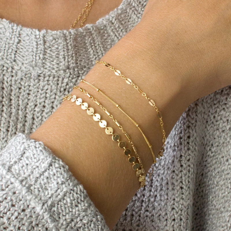 Chic Minimalist 4-Piece Gold Tone Layering Bracelet Stack with Disc & Tube Charms Feminé Luxé