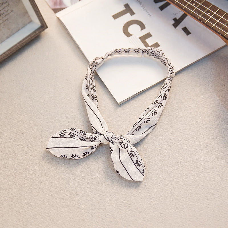 The Parisian Bow Headband: Chic Fabric Knot & Bunny Ear Tie - Designer Print Hair Accessory for Effortless French Style Feminé Luxé