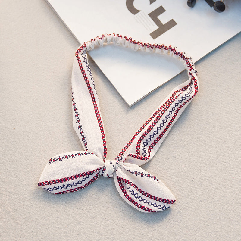 The Parisian Bow Headband: Chic Fabric Knot & Bunny Ear Tie - Designer Print Hair Accessory for Effortless French Style Feminé Luxé