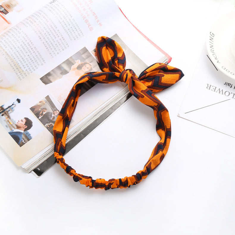 The Parisian Bow Headband: Chic Fabric Knot & Bunny Ear Tie - Designer Print Hair Accessory for Effortless French Style Feminé Luxé