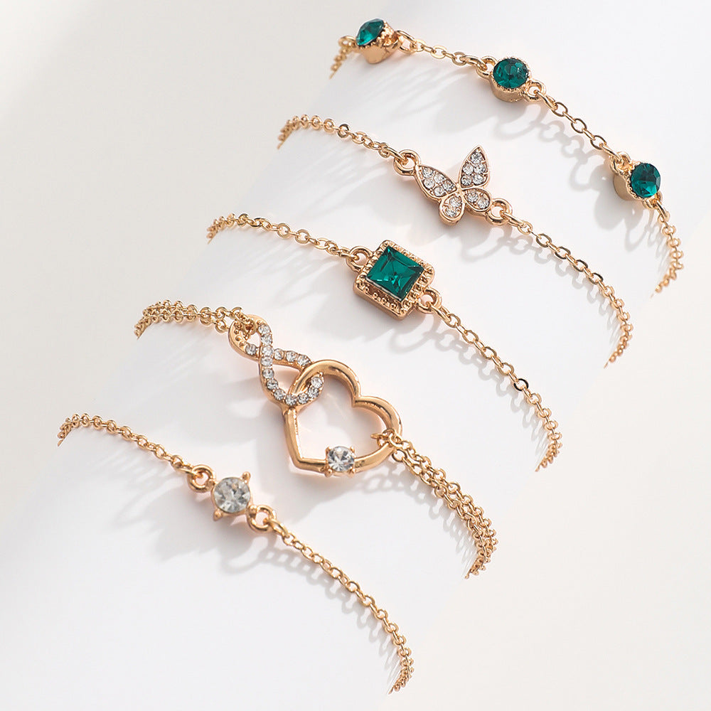Bohemian 6-Piece Green Crystal Layering Bracelet Stack with Heart & Butterfly Charms Feminé Luxé