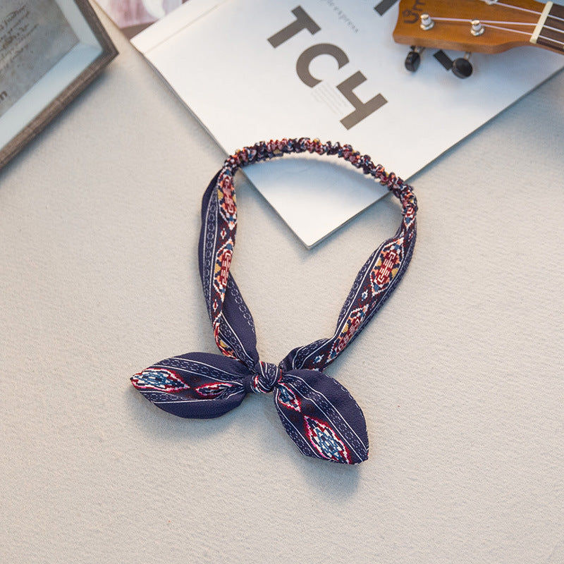 The Parisian Bow Headband: Chic Fabric Knot & Bunny Ear Tie - Designer Print Hair Accessory for Effortless French Style Feminé Luxé