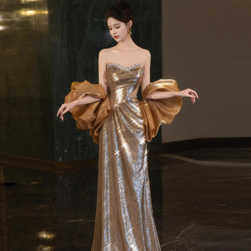 Golden Metallic Strapless Evening Gown with Dramatic Bow Feminé Luxé