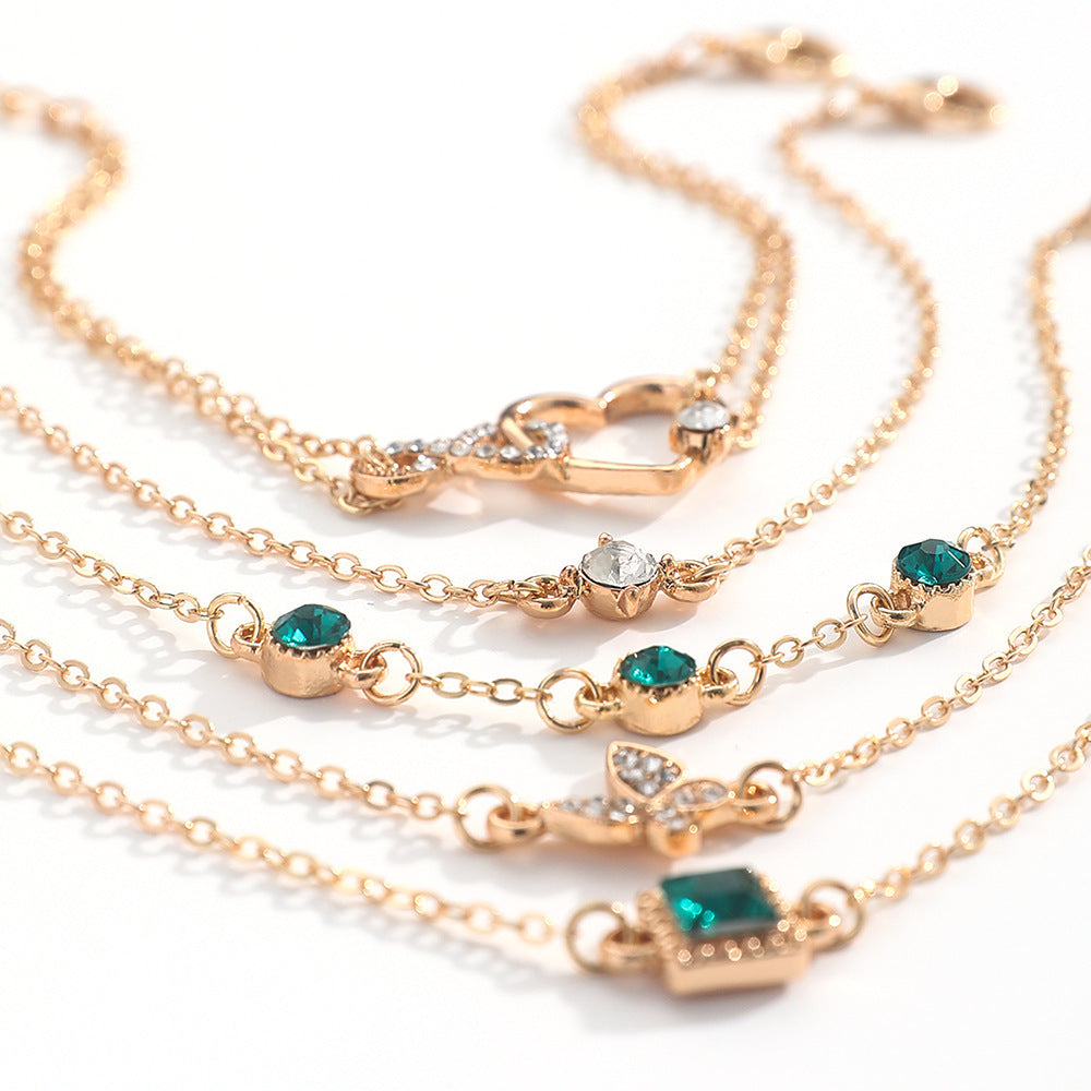 Bohemian 6-Piece Green Crystal Layering Bracelet Stack with Heart & Butterfly Charms Feminé Luxé