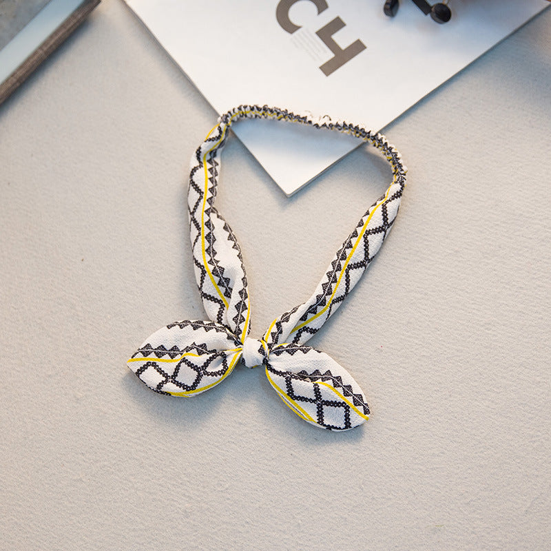 The Parisian Bow Headband: Chic Fabric Knot & Bunny Ear Tie - Designer Print Hair Accessory for Effortless French Style Feminé Luxé