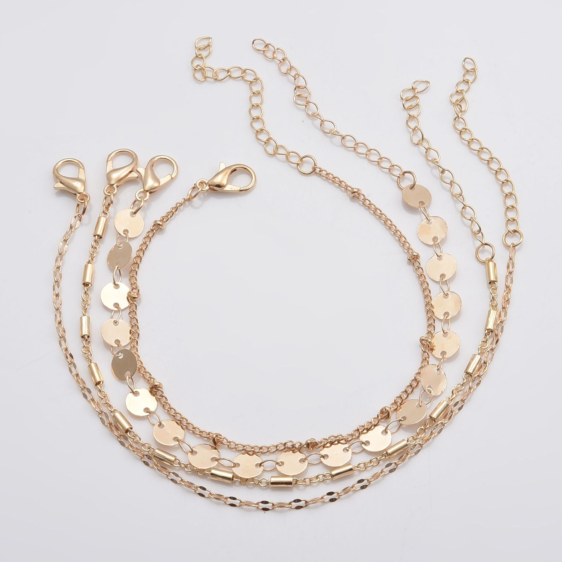 Chic Minimalist 4-Piece Gold Tone Layering Bracelet Stack with Disc & Tube Charms Feminé Luxé