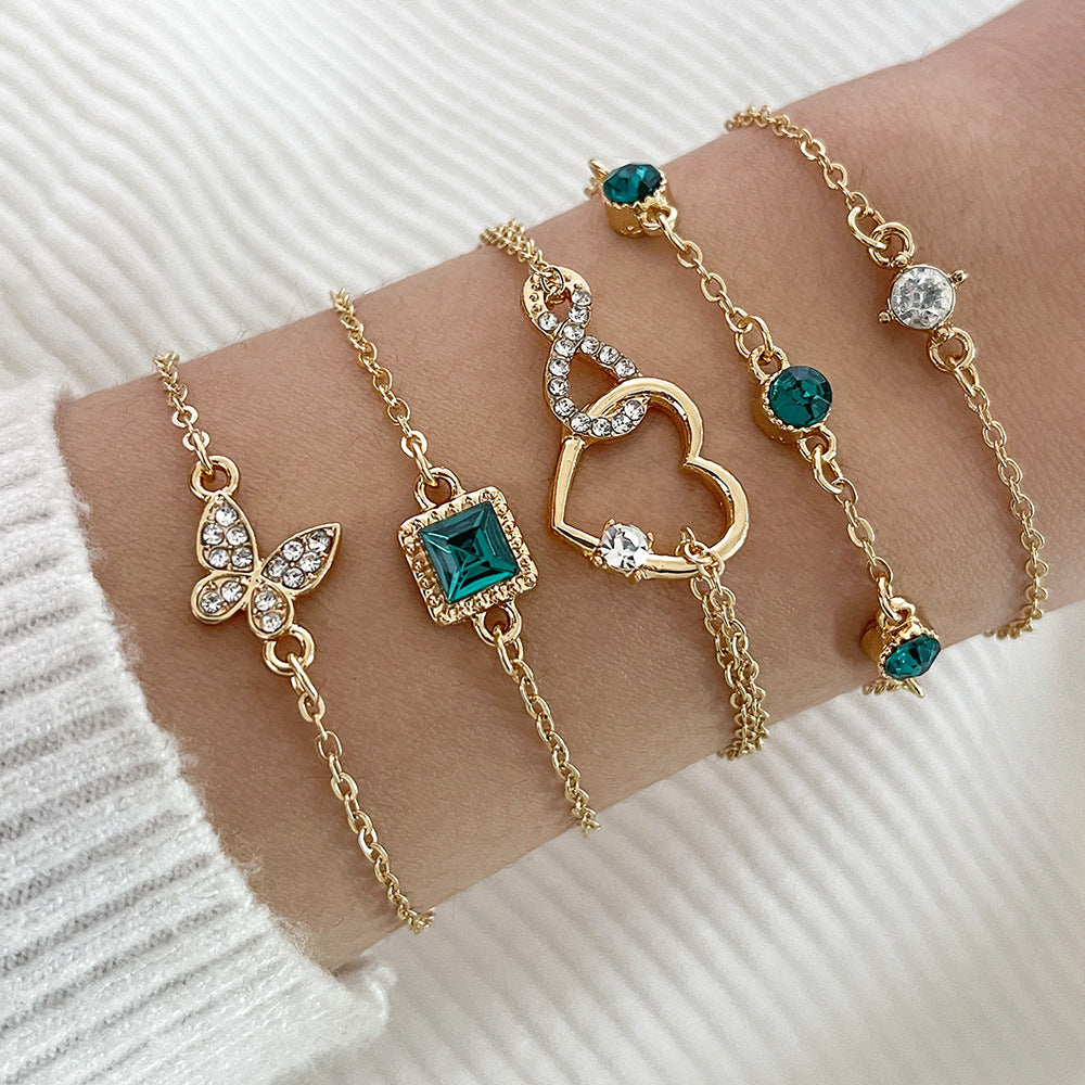 Bohemian 6-Piece Green Crystal Layering Bracelet Stack with Heart & Butterfly Charms Feminé Luxé